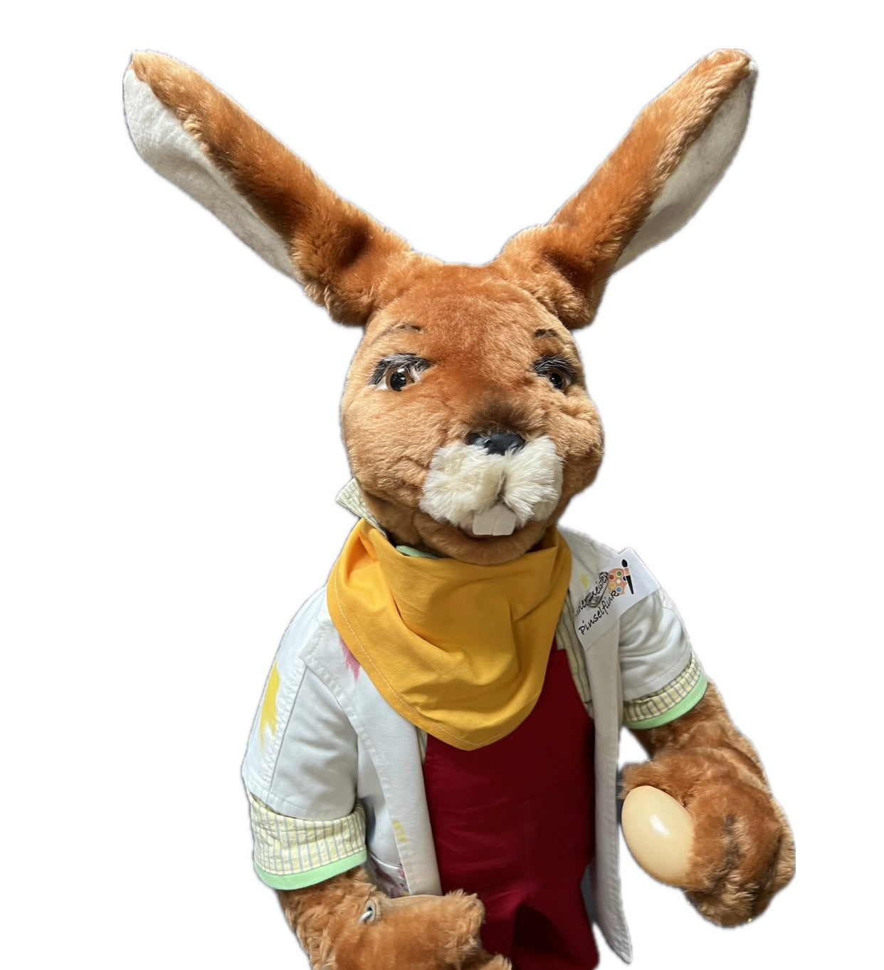 Hase mit gelben Halstuch bringt Eier