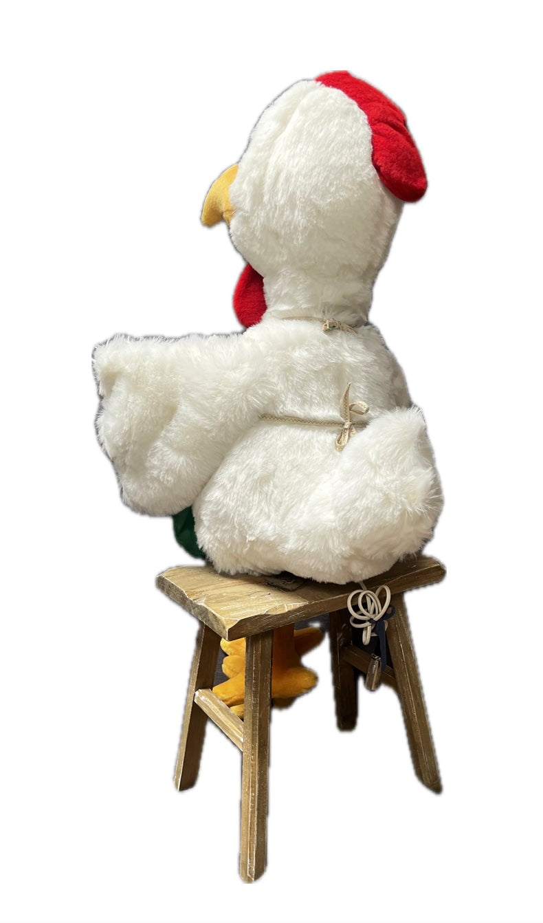 Huhn mit grüner Schürze und Ei