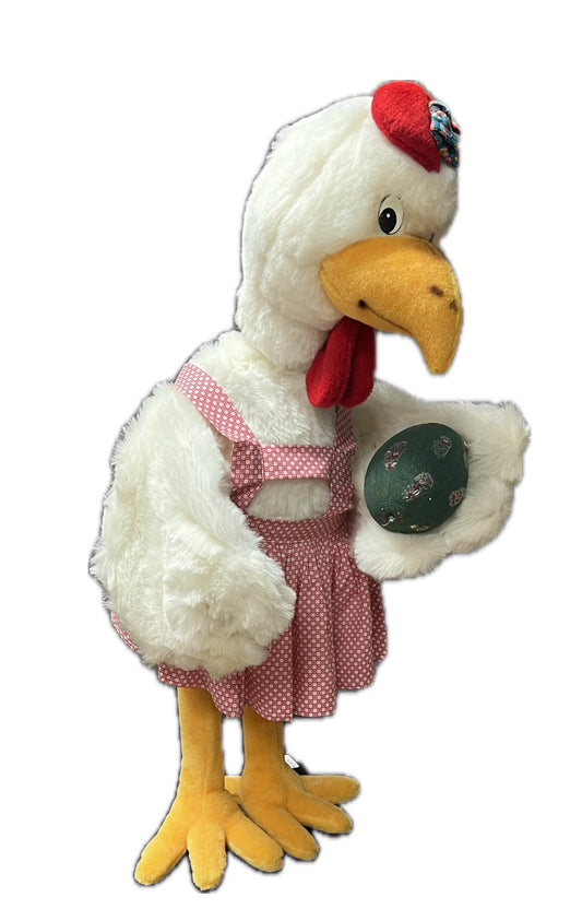 Huhn mit rosa Schürze und Ei