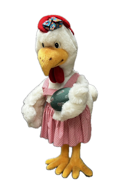 Huhn mit rosa Schürze und Ei