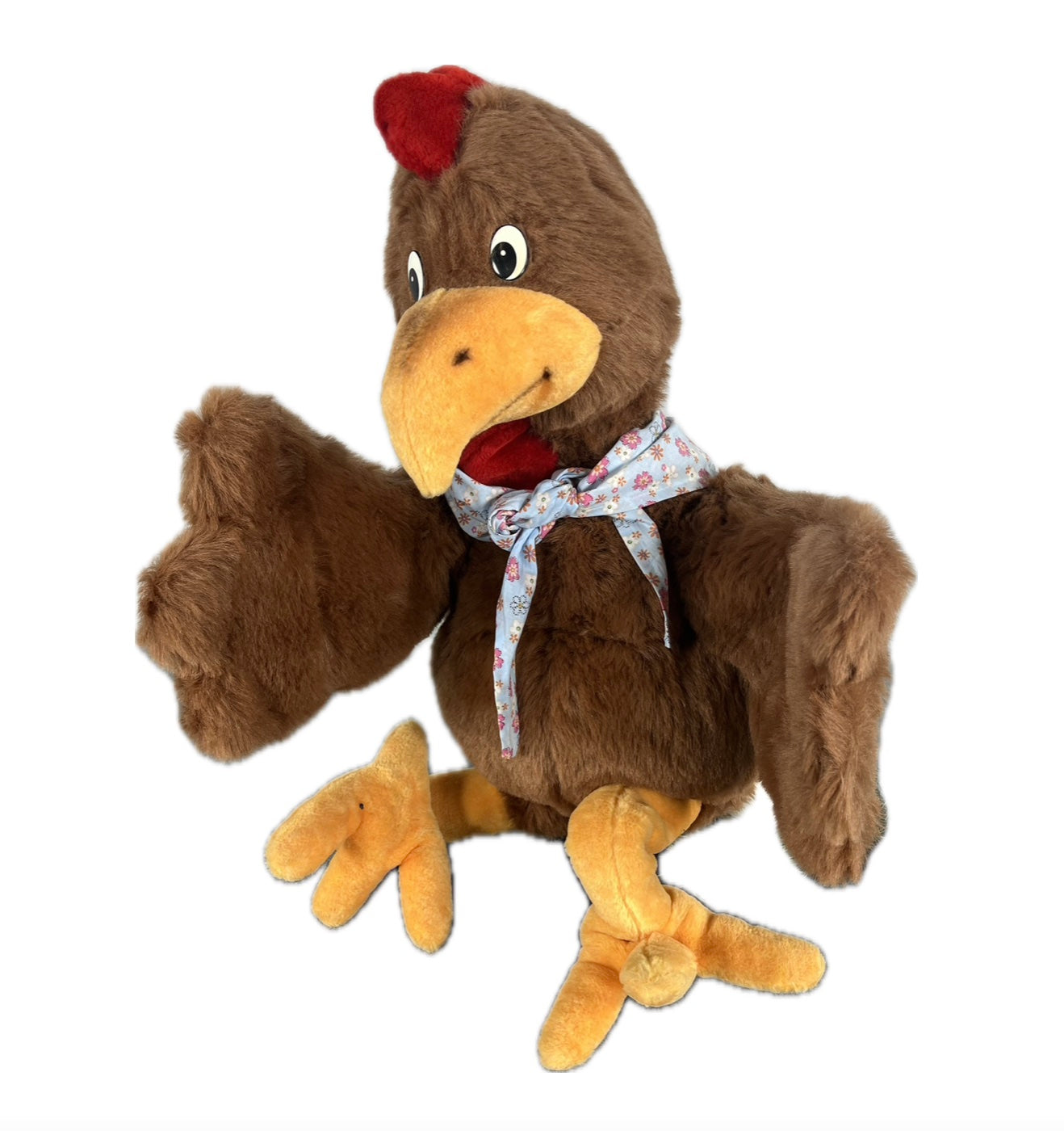 Huhn mit Halstuch legt scheinbar Eier